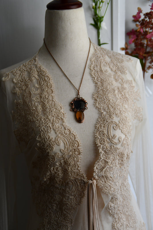 Ritual: The Story Weaver Mirror Pendant with Insect Amber and Garnet