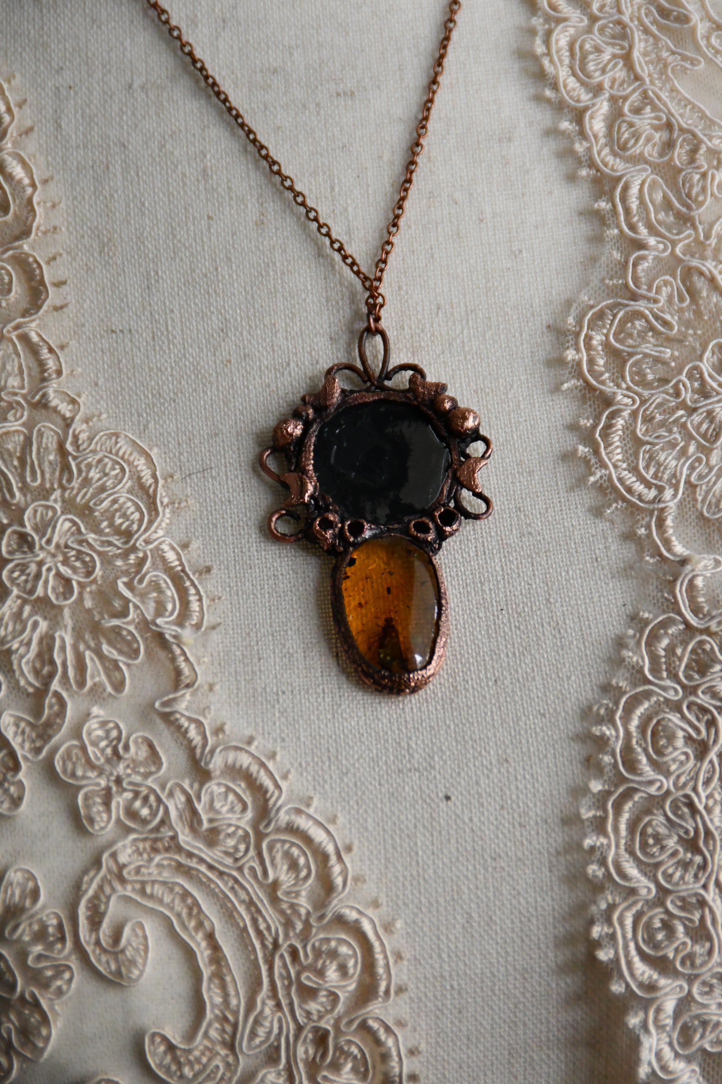 Ritual: The Story Weaver Mirror Pendant with Insect Amber and Garnet