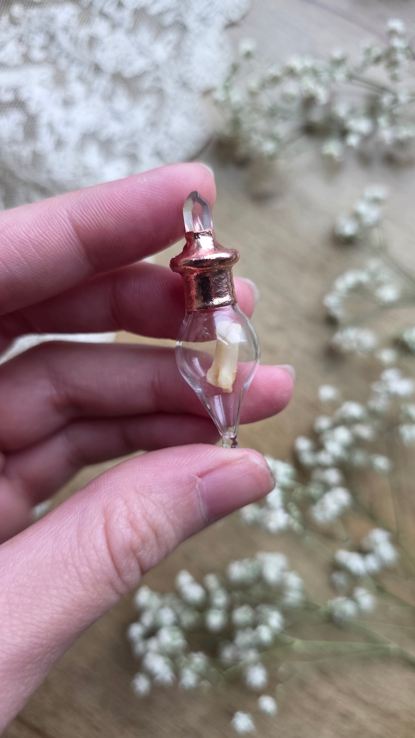 Black cat toe bone copper vial necklace.