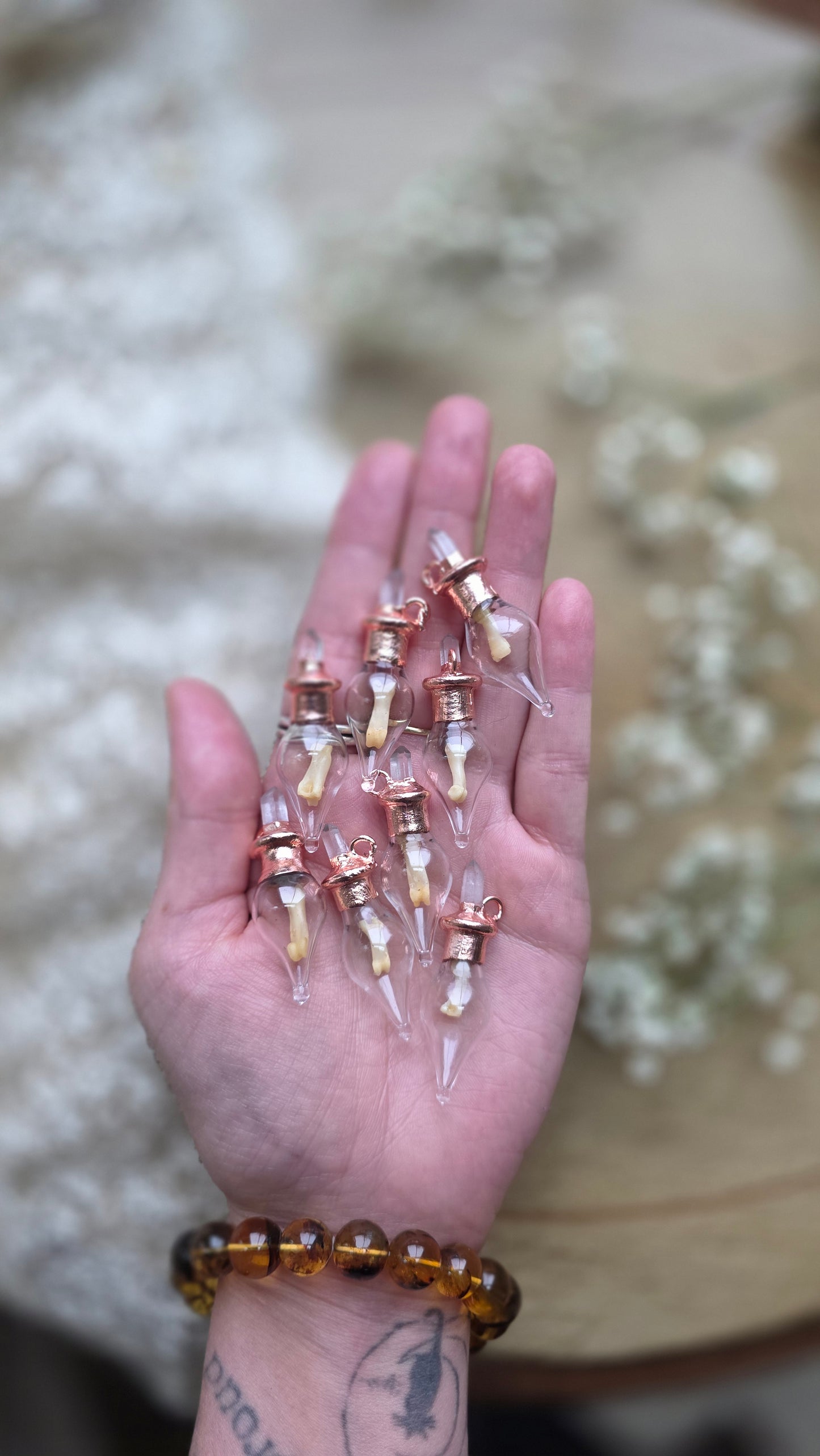 Black cat toe bone copper vial necklace.