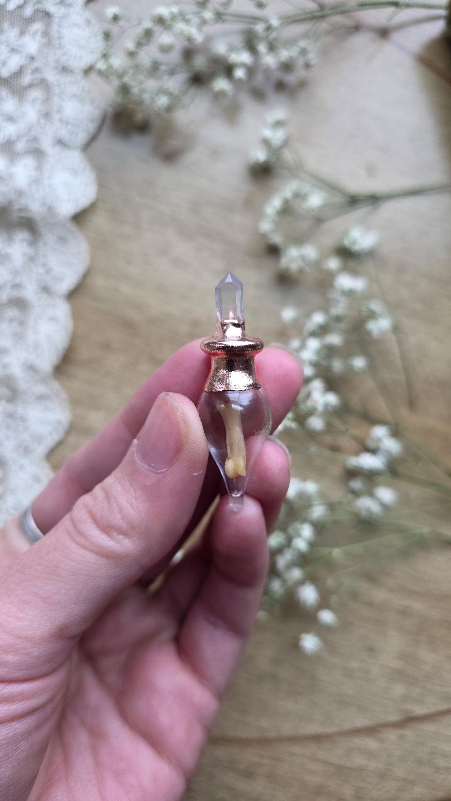 Black cat toe bone copper vial necklace.