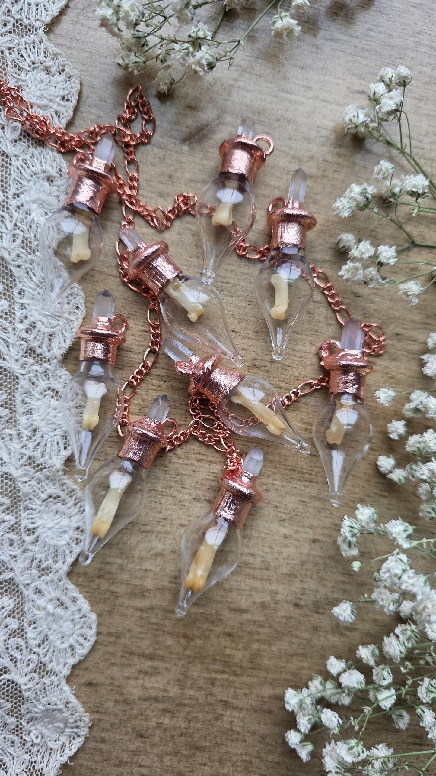 Black cat toe bone copper vial necklace.