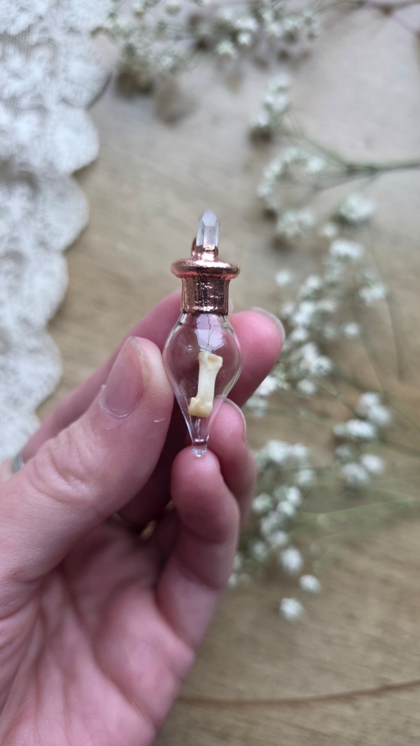 Black cat toe bone copper vial necklace.