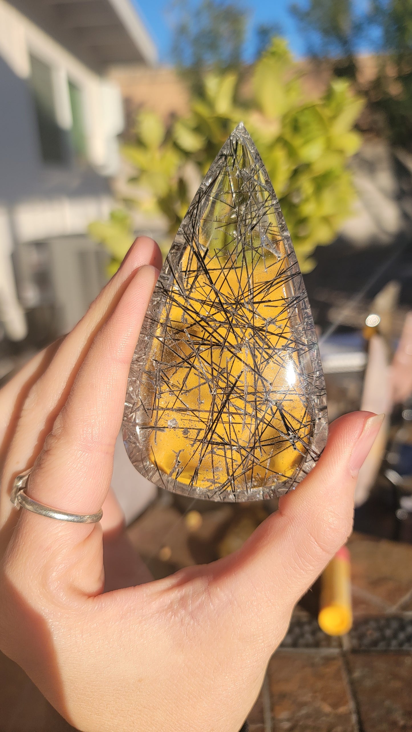 Giant tourmalinated quartz cabochon