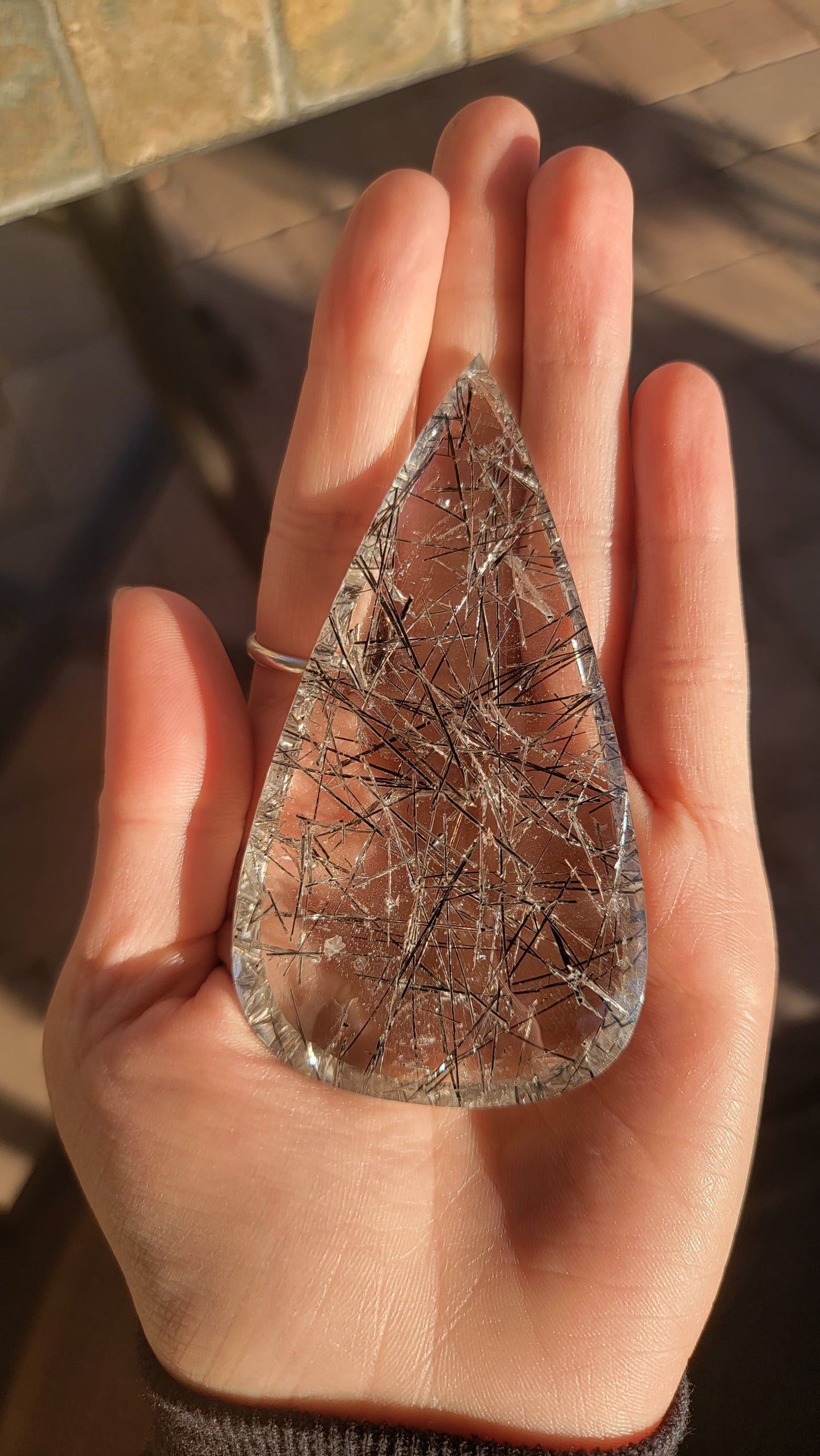 Giant tourmalinated quartz cabochon